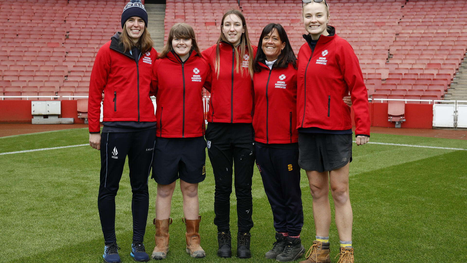 group of smiling grounds keepers